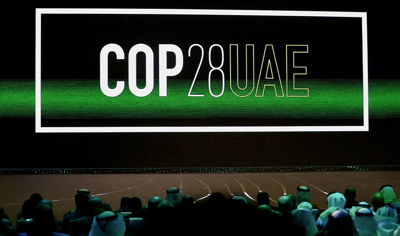 'Cop28 UAE' logo is displayed on the screen during the opening ceremony of Abu Dhabi Sustainability Week (ADSW) under the theme of 'United on Climate Action Toward COP28', in Abu Dhabi, UAE, on January 16, 2023. (REUTERS)
