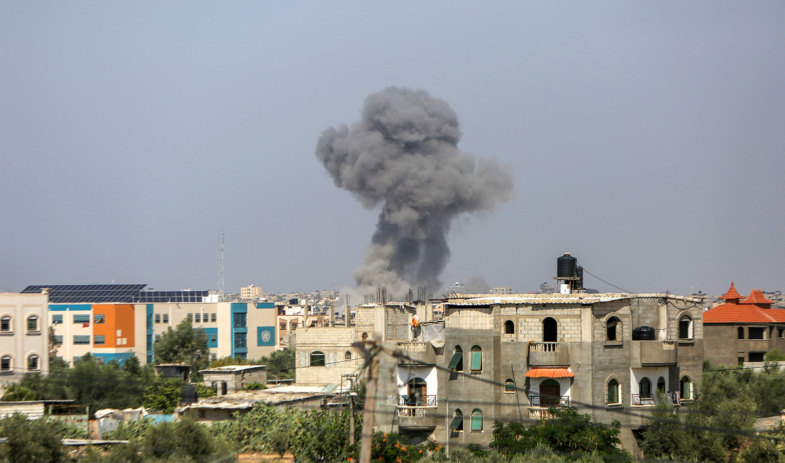 Smoke billows near the Rafah crossing with with Egypt on the southern Gaza Strip on October 23, 2023, amid ongoing battles between Israel and the Palestinian group Hamas. (AFP)