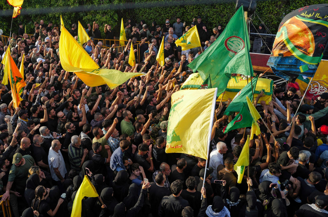People carry the coffin of Hezbollah member Haydar Ayad, who was killed in southern Lebanon amidst tension between Israel and Hezbollah, during his funeral, in Babliyeh Lebanon, October 24, 2023. (Reuters)