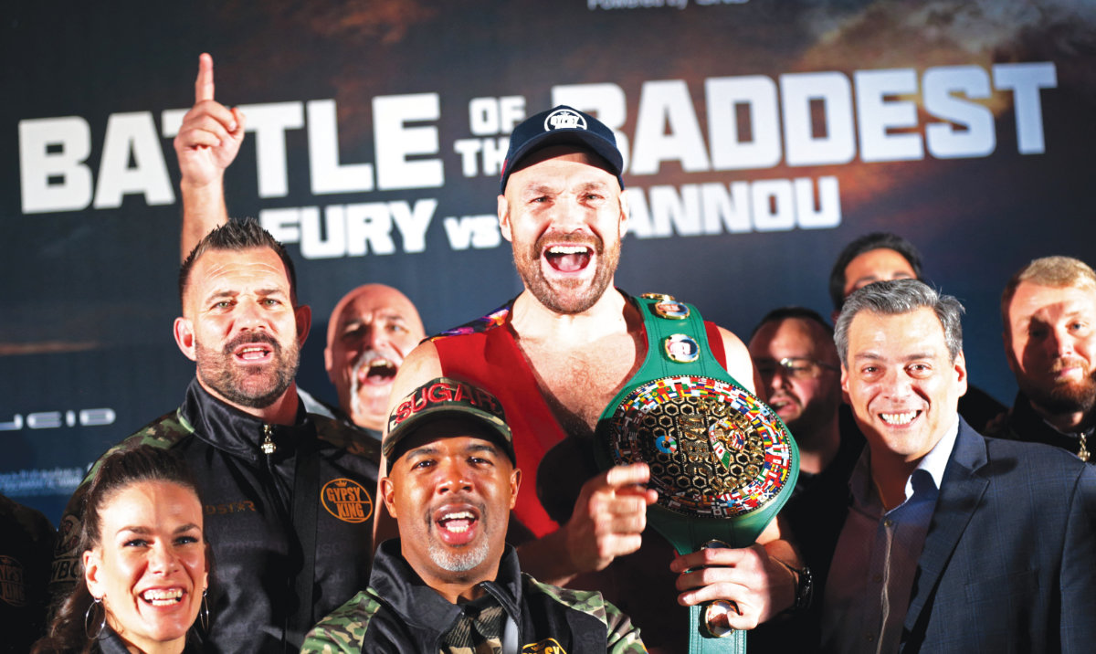 Tyson Fury poses with his team during the grand arrivals on Tuesday ahead of his fight against Francis Ngannou in Riyadh. (Reuters)