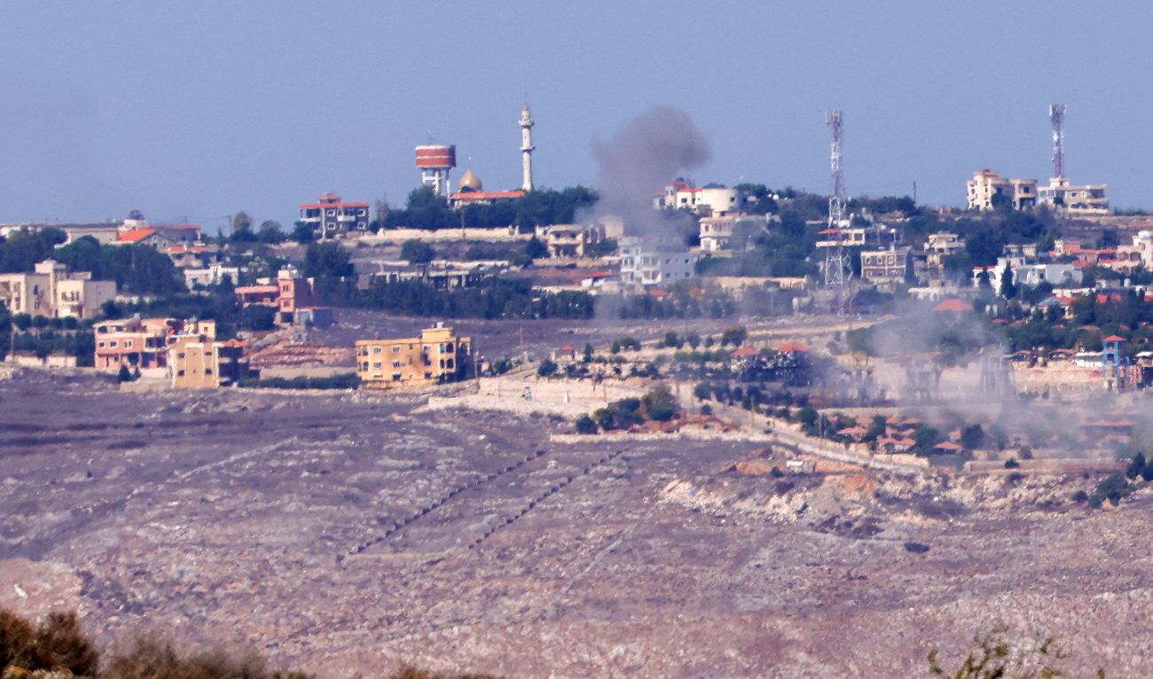 Smoke rises above buildings the southern Lebanese village of Maroun Al-Ras, opposite the Israeli Moshav of Avivim during Israeli artillery shelling on October 25, 2023. (AFP/File)