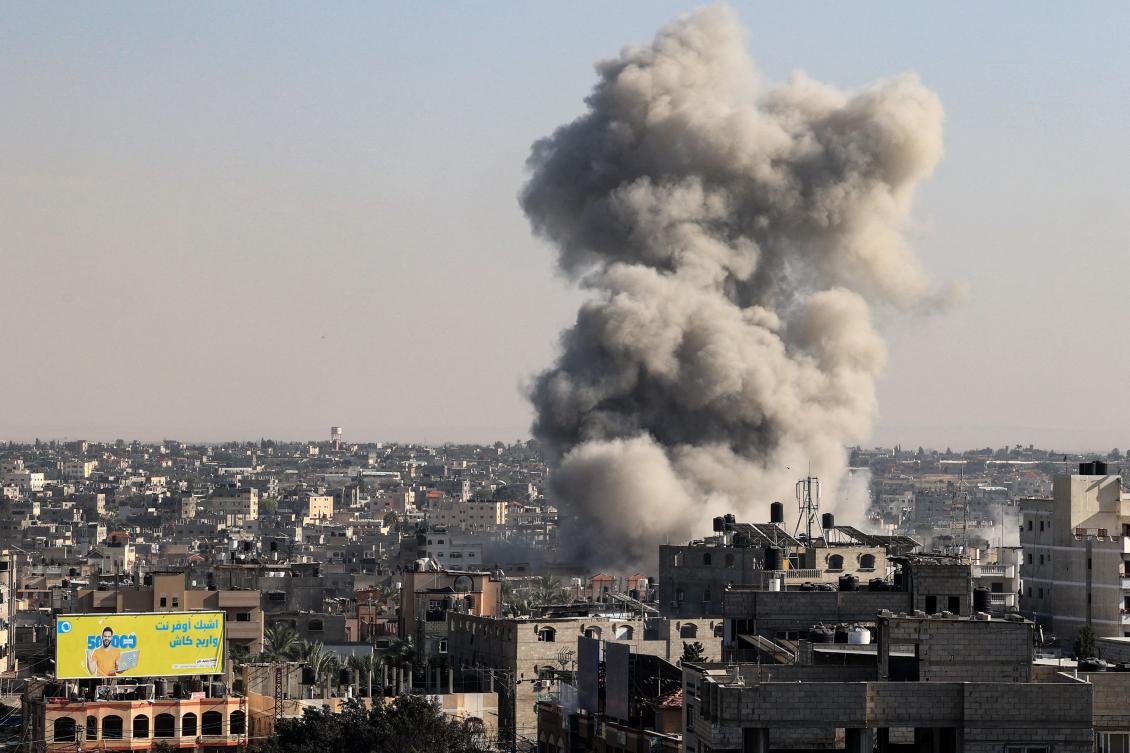 Smoke rises above buildings during an Israeli air Stike on Rafah in southern Gaza Strip, amid ongoing battles between Israel and the Palestinian Hamas movement. (AFP)