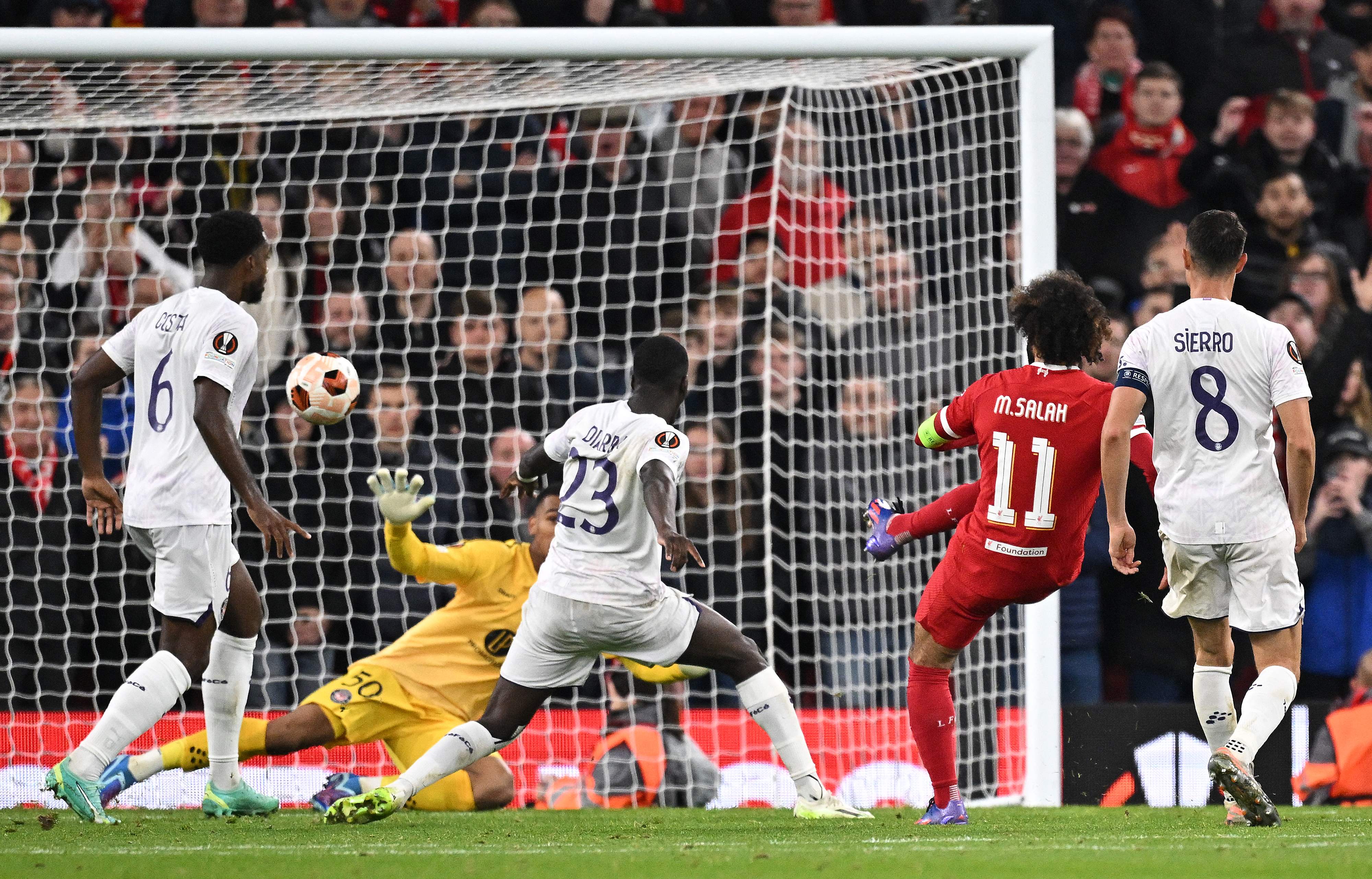 Liverpool's Egyptian striker Mohamed Salah scores the team's fifth goal during the UEFA Europa League Group E football match between Liverpool and Toulouse at Anfield in Liverpool, England on Thursday. (AFP)