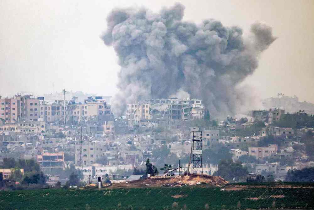 This picture taken from a position along the border with the Gaza Strip near Israel's southern city of Sderot on October 27, 2023 shows a smoke plume ascending following Israeli bombardment over the northern Gaza Strip amid the ongoing battles between Israel and the Palestinian group Hamas. (AFP)