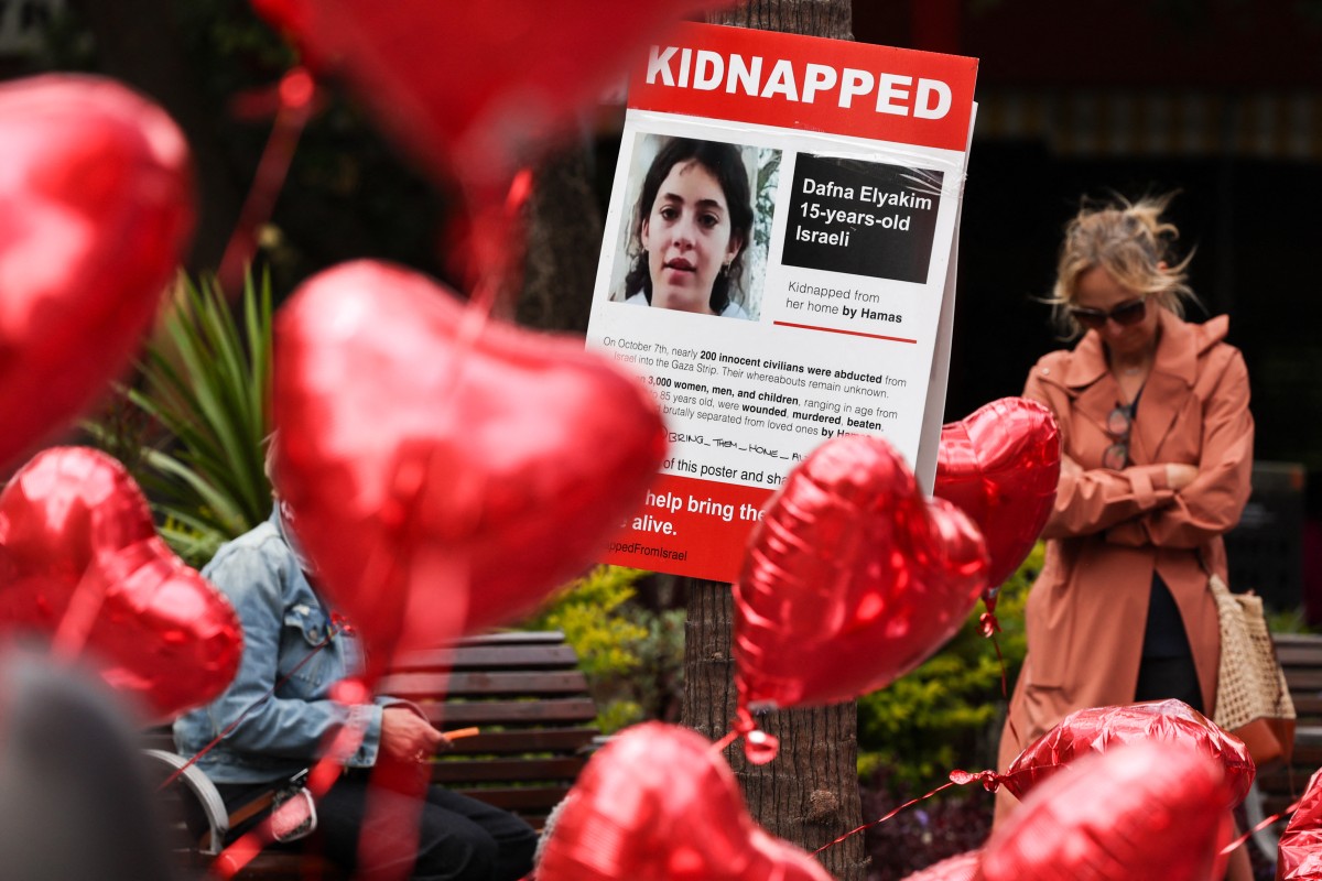 The posters have been distributed in various cities worldwide to raise awareness about the captive Israeli citizens. (AFP/File)