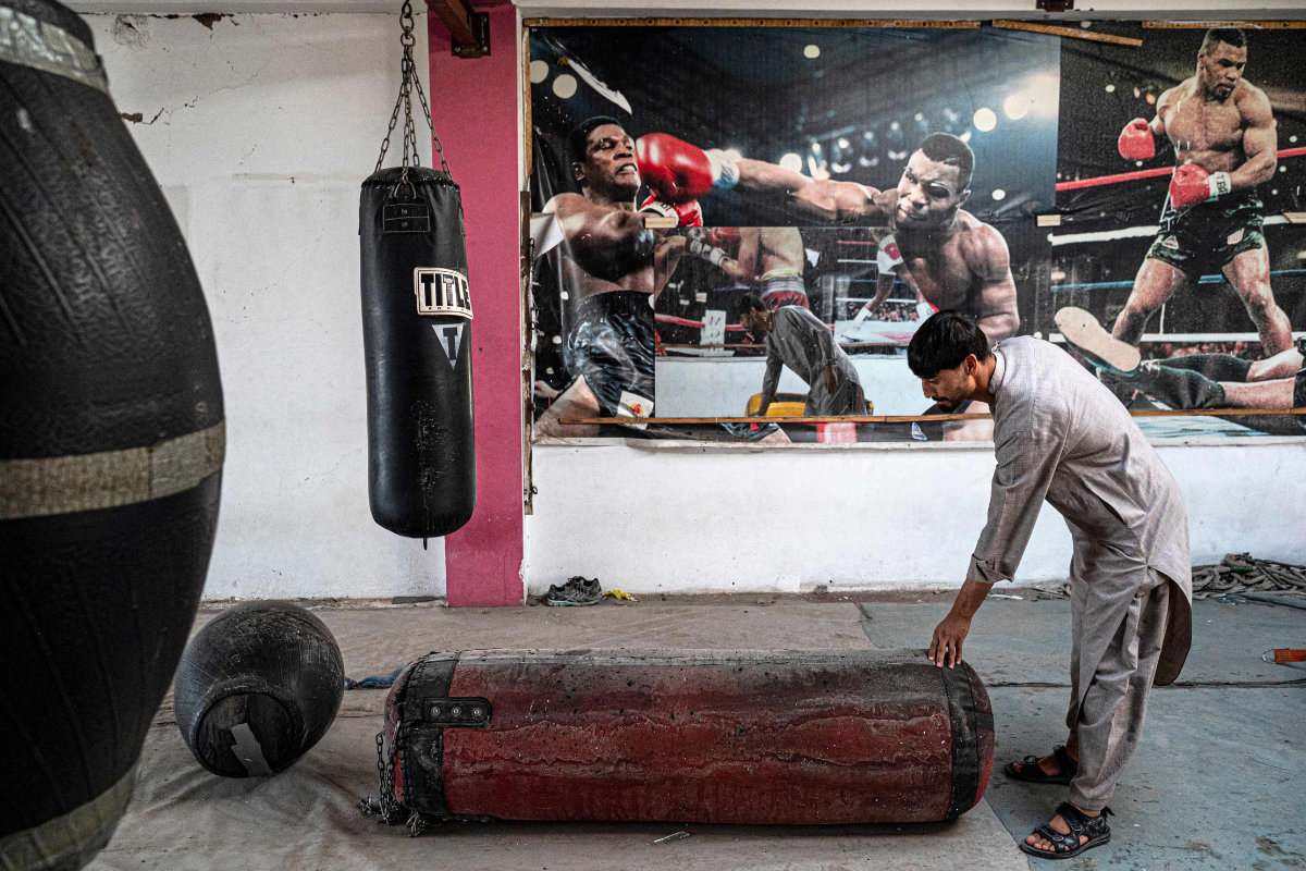 An Afghan man inspects gears at the Mellat boxing club, a day after an explosion took place at the site in the Dasht-e-Barchi neighbourhood of Kabul on October 27, 2023. (AFP)