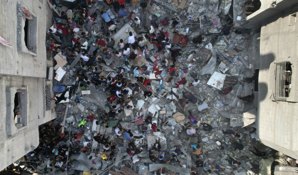 Palestinians look for survivors of an Israeli bombardment of the Gaza Strip in the Nusseirat refugee camp. (AFP)