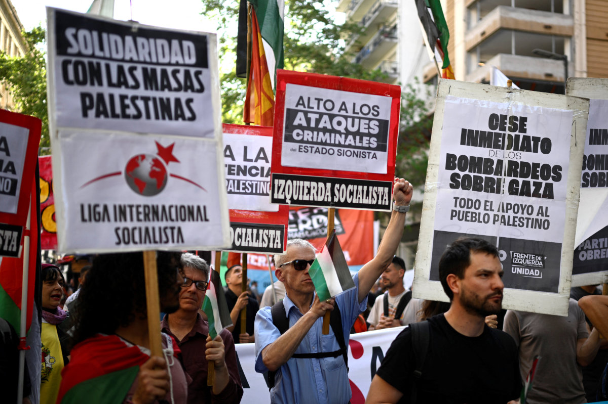 Demonstrators take part in a rally in support for the Palestinian people in front of the Israeli embassy in Buenos Aires on October 9, 2023. (AFP)