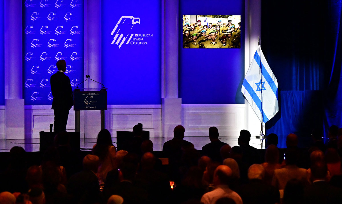 Attendees listen to the national anthems of the United States and Israel ahead of the Shabbat dinner on opening day of the Republican Jewish Coalition leadership summit at the Venetian Conference Center in Las Vegas, Nevada, on October 27, 2023. (AFP)