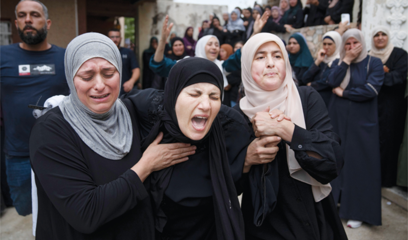 Palestinians mourn a man killed during an Israeli army raid in Bait Reema. (AP)