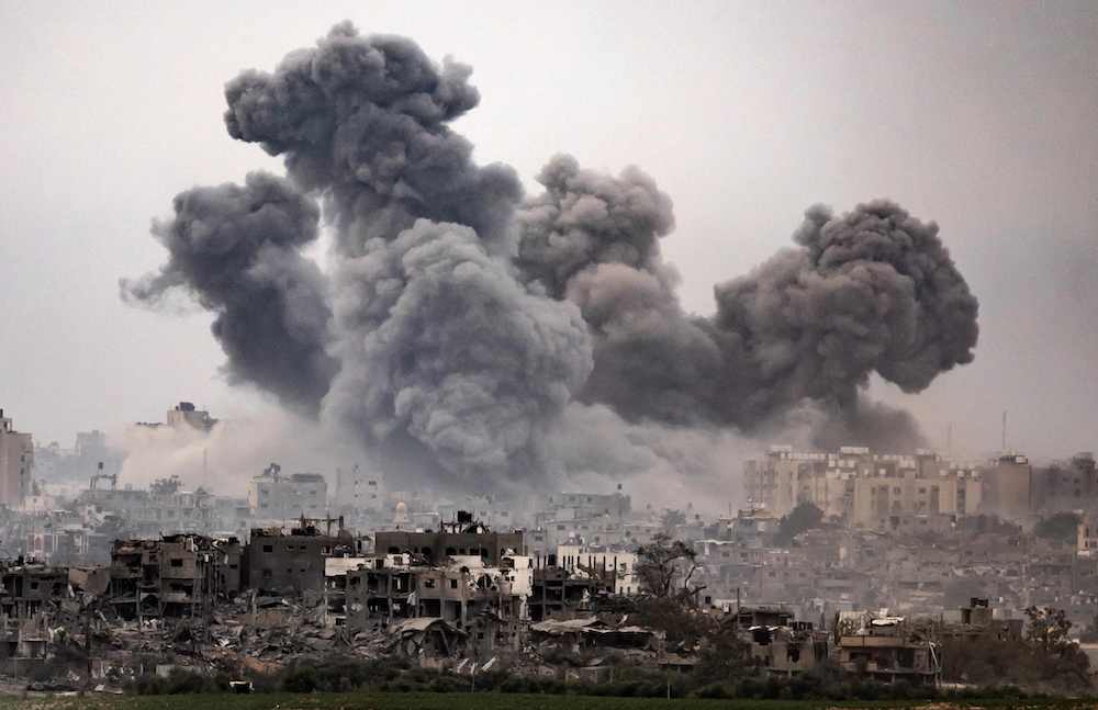 Black smoke ascends from the Gaza Strip amid heavy bombardment of the Israeli army on the Palestinian enclave. (AFP)