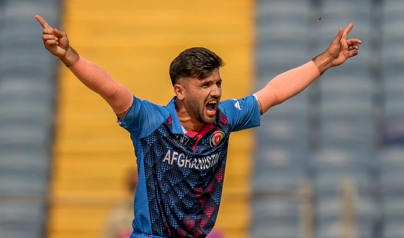 Afghanistan's Fazalhaq Farooqi appeals successfully against the for the wicket of Sri Lanka's Dimuth Karunaratne during the ICC Men's Cricket World Cup match between Sri Lanka and Afghanistan in Pune, India, on October 30, 2023. (AP)