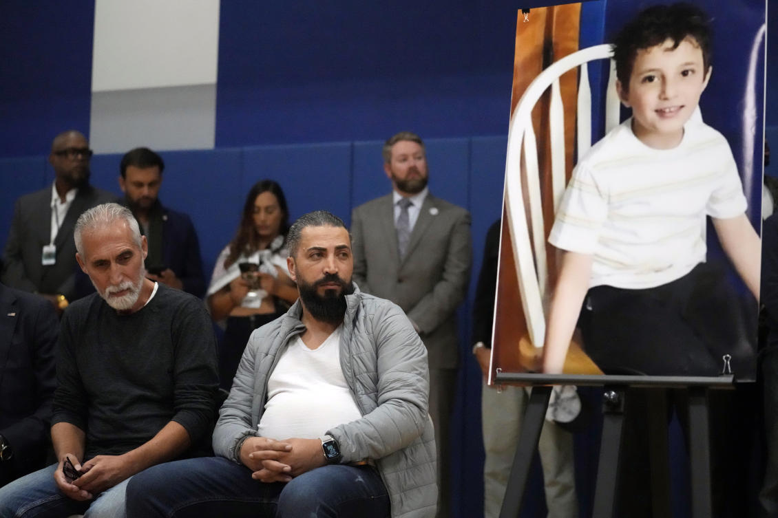 Wadea Al Fayoume's father, Oday Al Fayoume, right, and his uncle Mahmoud Yousef attend a vigil for Wadea at Prairie Activity and Recreation center in Plainfield, Ill. (AP)