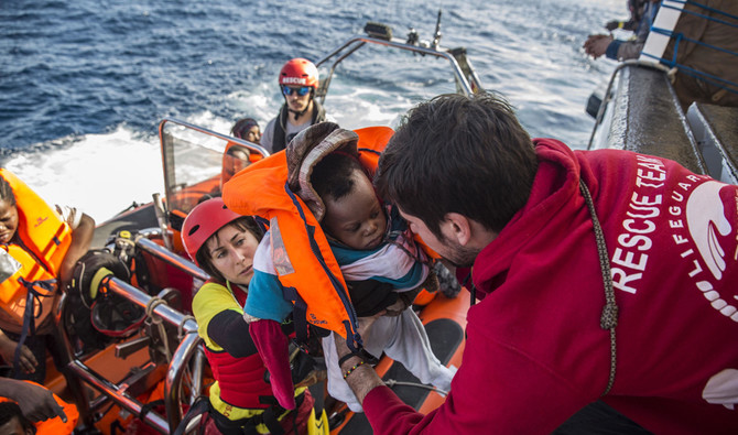 A baby is taken to the vessel of the Spanish Proactiva Open Arms, after being rescued in the Central Mediterranean Sea, 72 km from Al-Khums, Libya. (File/AP)