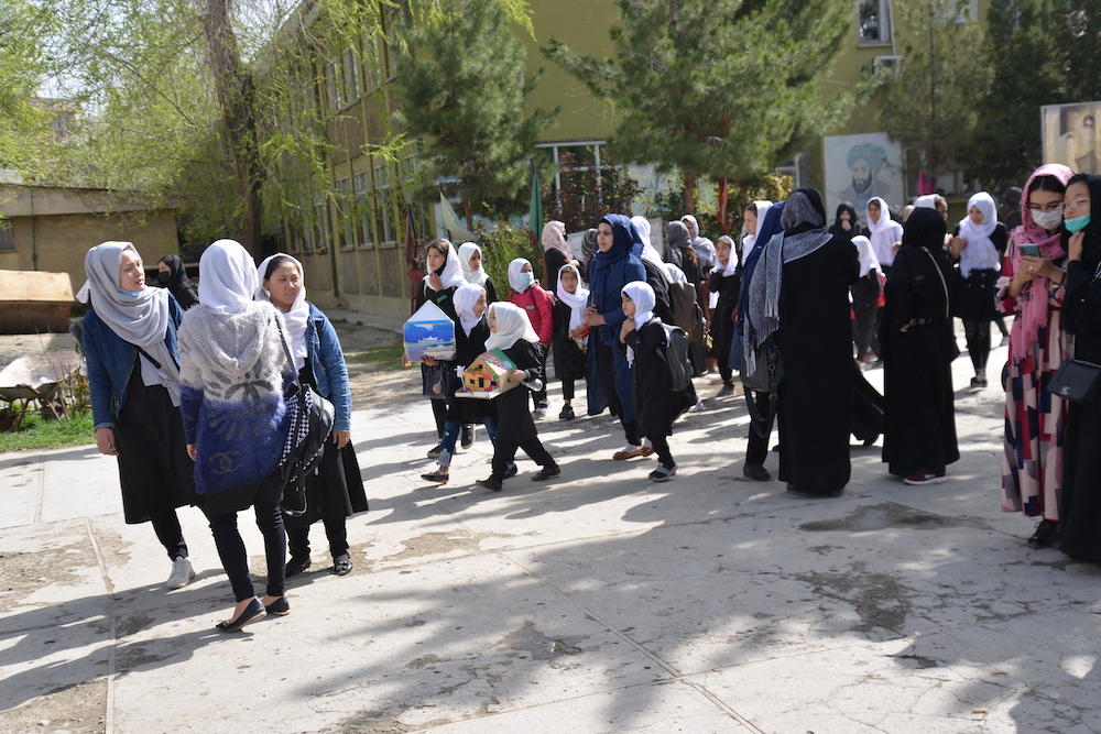 Above, Afghan girls leave their school following order of closure just hours after reopening in Kabul on March 23, 2022. (AFP)