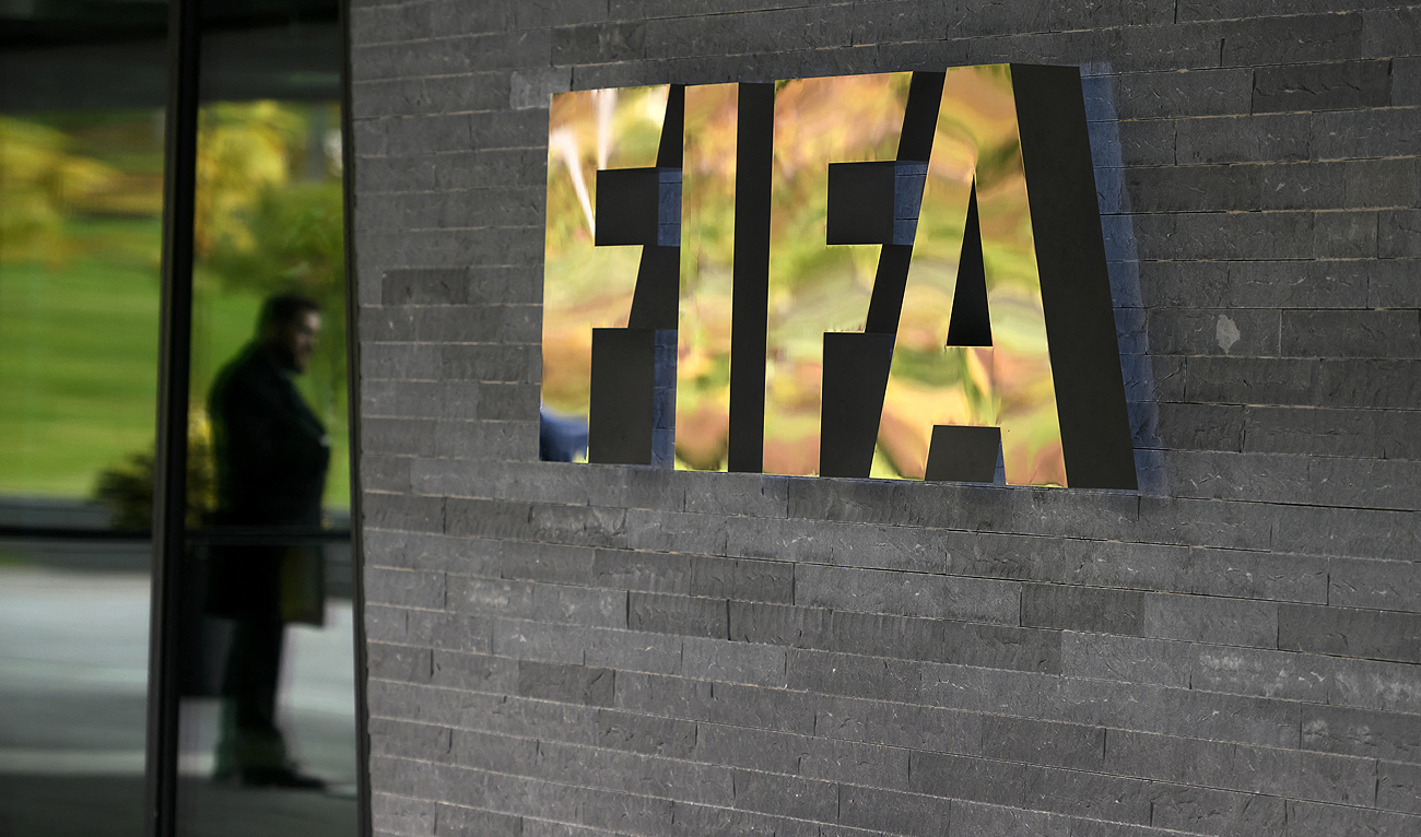 In this photo, taken on October 13, 2016, a sign of the FIFA is seen at the entrance of the world football's governing body headquarters in Zurich. (AFP/File)