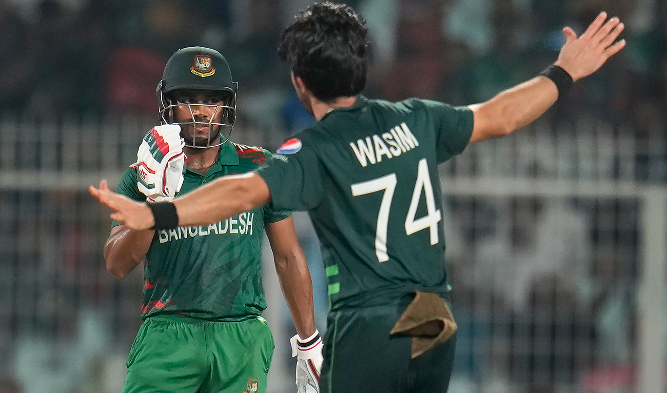Bangladesh's Mehidy Hasan Miraz, facing the camera, is bowled out by Pakistan's Mohammad Wasim during the ICC Men's Cricket World Cup match between Bangladesh and Pakistan in Kolkata, India, Tuesday, Oct. 31, 2023. (AP)