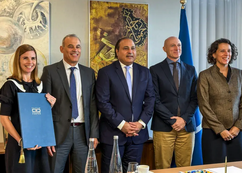 KAICIID Sec Gen Dr. Zuhair Alharthi, center, stands with members of the two organizations. (Supplied)