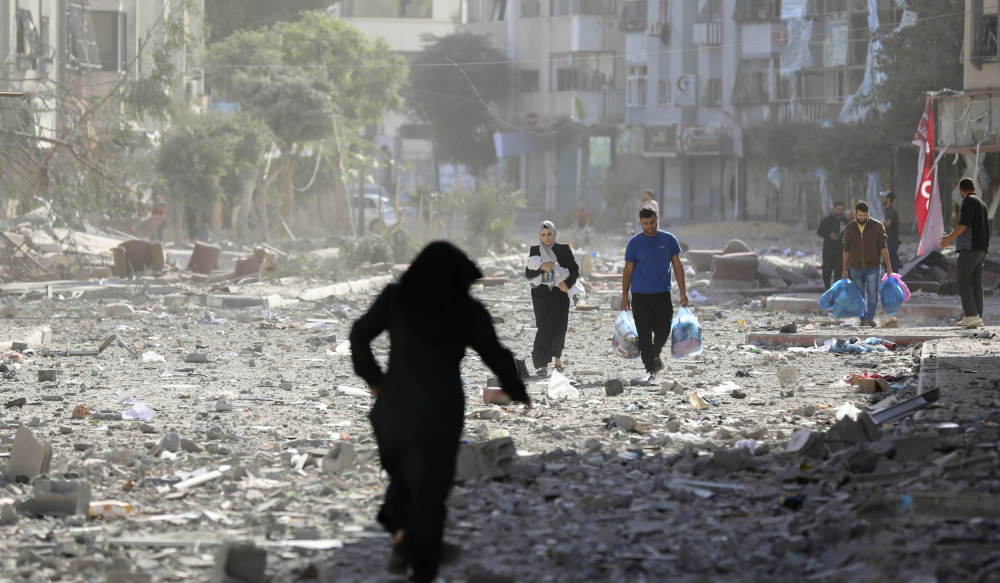 Palestinians leave their homes following Israeli bombardment on Gaza City, Monday, Oct. 30, 2023. (AP)