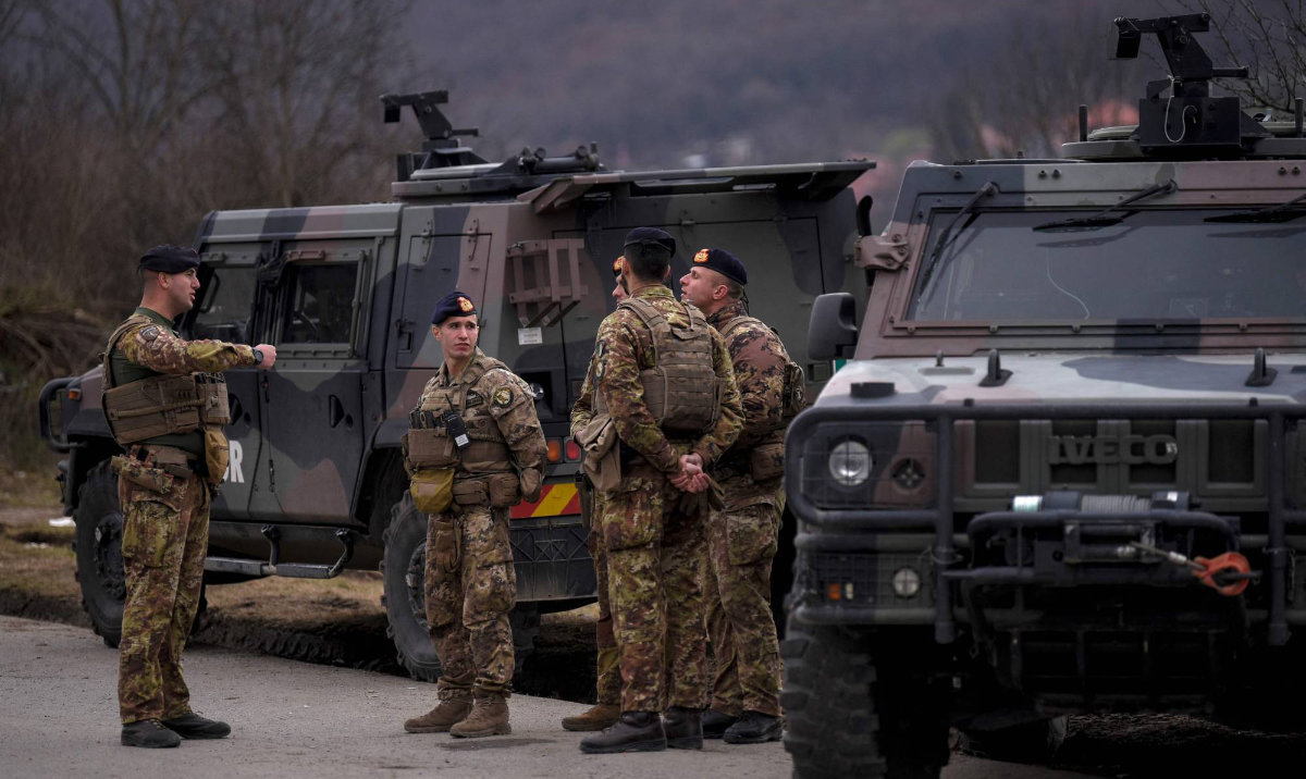 NATO peacekeeping soldiers patrol near the town of Zvecan in Kosovo. (AFP)