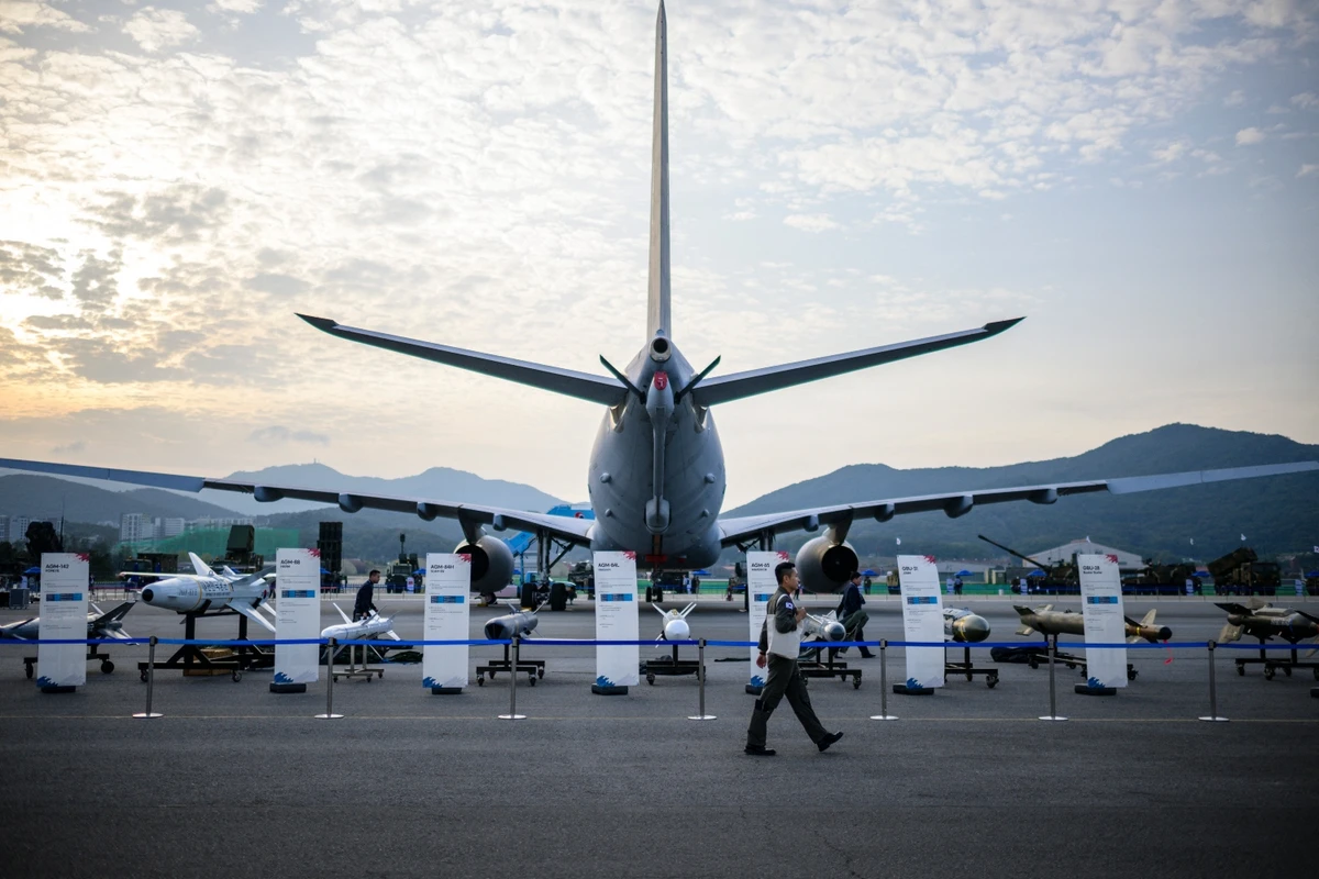 A soldier walks past a display of missiles at the ADEX in Seongnam, south of Seoul. Oct. 18, 2023 (File/AFP)