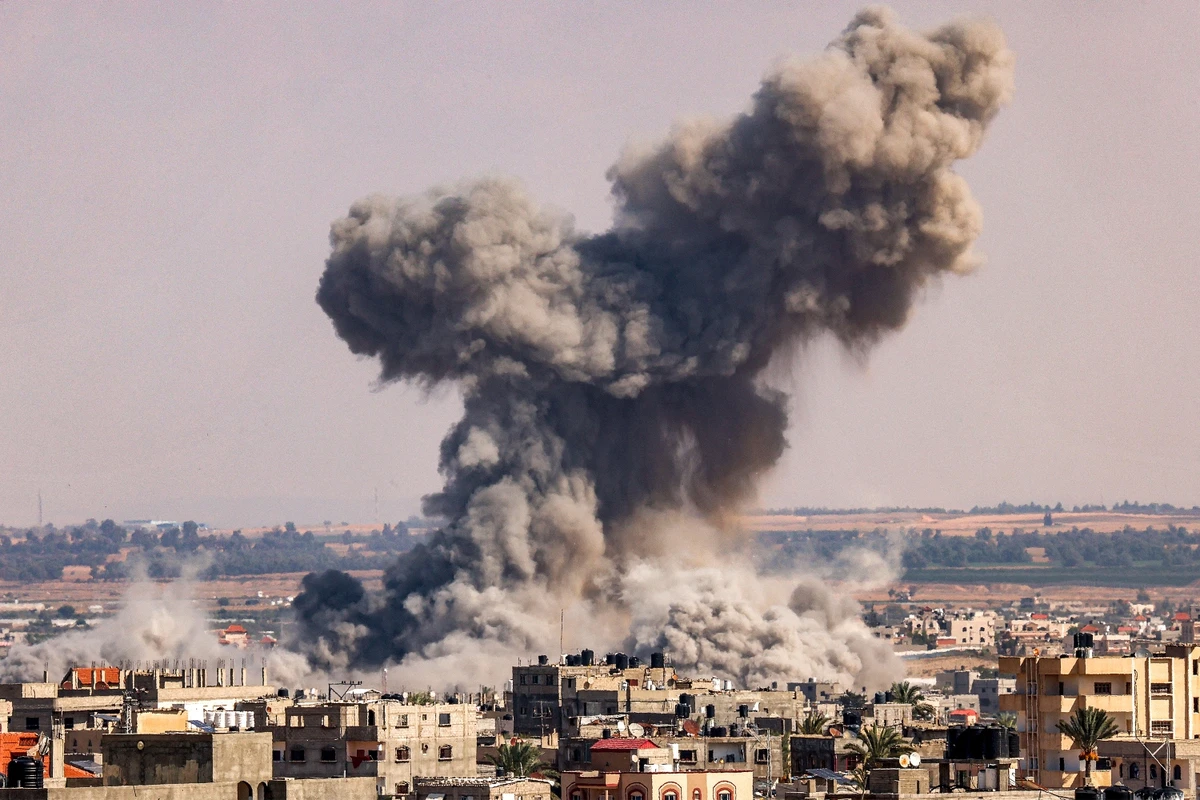A smoke plume erupts during Israeli bombardment in Rafah in the southern Gaza Strip. Oct. 19, 2023 (File/AFP)