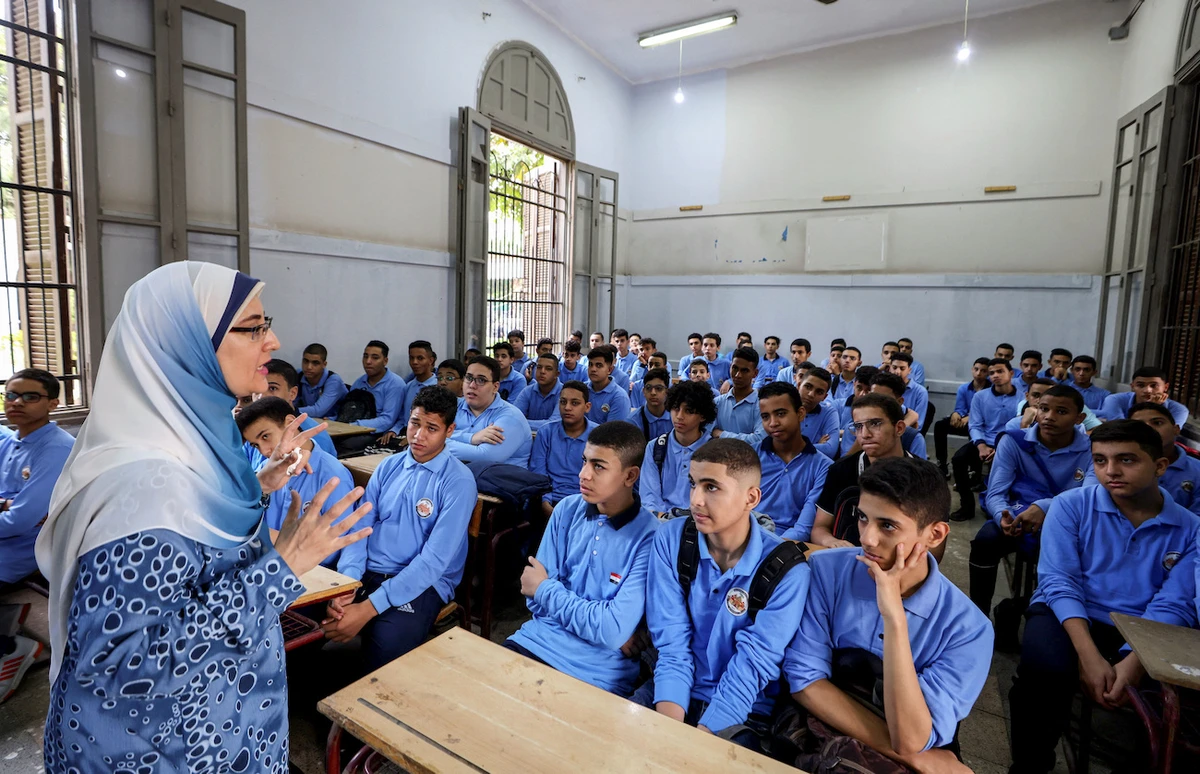 An Egyptian teacher instructs students on the first day of the academic year at Al-Sadeeya school, in Cairo, Egypt October 1, 2023. (Reuters)