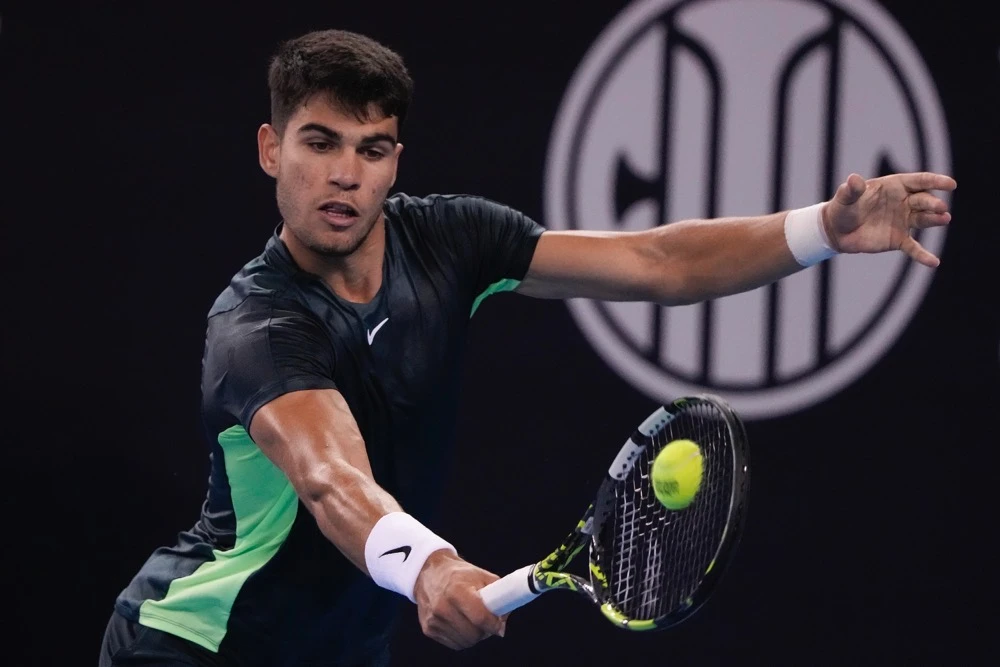 Carlos Alcaraz of Spain returns a backhand shot against Casper Ruud of Norway during the men's singles quarterfinal in the China Open tennis tournament at the Diamond Court in Beijing Monday. (AP)