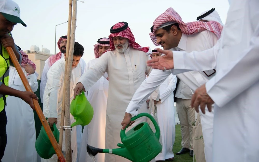 The work in the Al-Nakheel neighborhood includes planting 50,000 trees and shrubs and establishing parks and green areas. (Supplied)