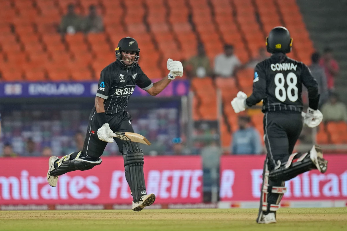 New Zealand's Rachin Ravindra and teammate Devon Conway complete the winning run during the ICC Cricket World Cup opening match between England and New Zealand in Ahmedabad, India, Thursday. (AP)