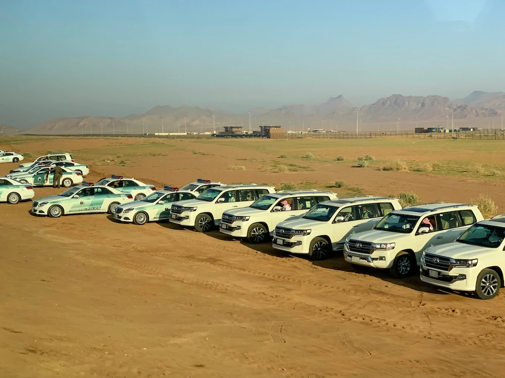 Dammam police arrested two citizens for attempting to distribute cannabis, amphetamines, shabu, and tablets subject to medical circulation regulations. Above, Saudi police vehicles in AlUla. (AFP file photo)