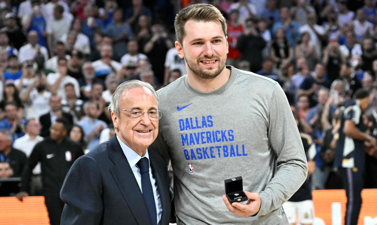 Dallas Mavericks' guard and former Real Madrid player Luka Doncic after receiving the Real Madrid's honor insigna from Real Madrid's Spanish president Florentino Perez prior to the NBA preseason game between Dallas Mavericks and Real Madrid Baloncesto. (AFP)