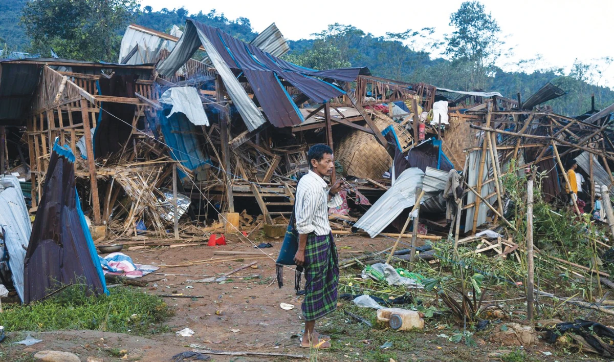 A man looks on at homes destroyed after air and artillery strikes in Mung Lai Hkyet displacement camp, in Laiza, Myanmar on Tuesday. (AP)