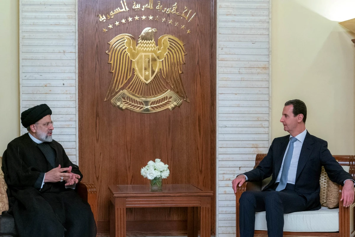 File Photo of President Bashar Assad and ranian President Ebrahim Raisi (AFP)