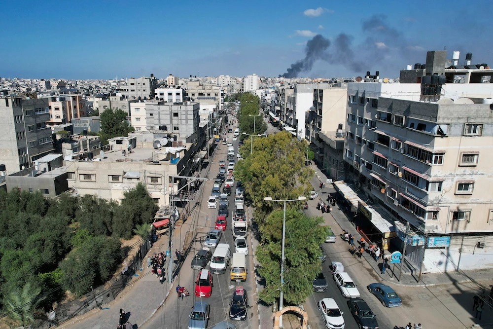 Palestinians flee from northern Gaza to the south after the Israeli army issued an unprecedented evacuation warning to a population of over 1 million people in northern Gaza and Gaza City to seek refuge in the south ahead of a possible Israeli ground invasion. (AP)