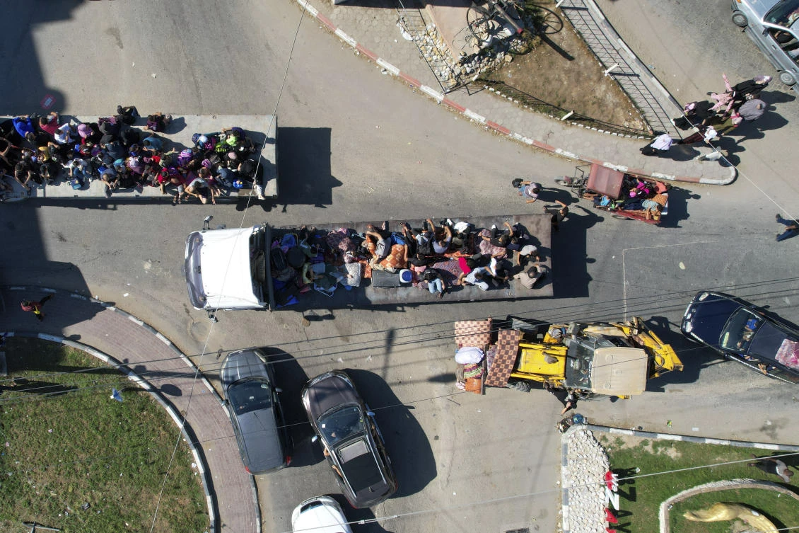 Palestinians fleeing from northern Gaza to the south after the Israeli army issued an unprecedented evacuation warning to a population of over 1 million people in northern Gaza and Gaza City to seek refuge in the south ahead of a possible Israeli ground invasion on Oct. 13, 2023. (AP)