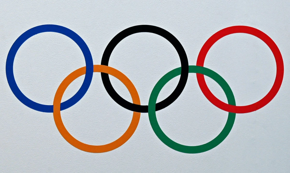 This photograph shows an Olympic signage sticker placed at the entrance of a venue ahead of the upcoming 141st International Olympic Committee (IOC) session in Mumbai on October 12, 2023. (AFP)