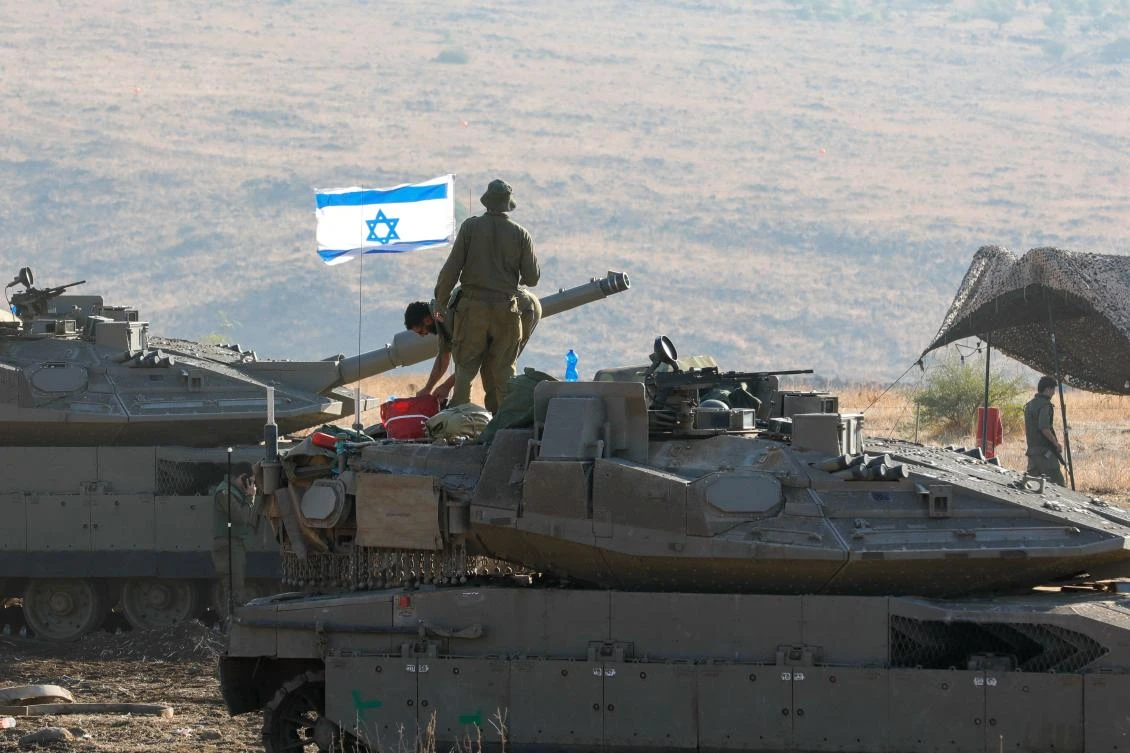 Israeli Merkava tanks are positioned in the north of Israel near the border with Lebanon on October 15, 2023. (AFP)