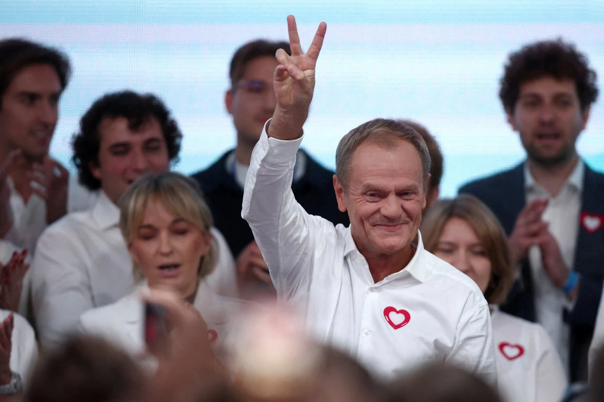 Donald Tusk, leader of Poland's largest opposition grouping Civic Coalition (KO), gestures after the exit poll results are announced in Warsaw on October 15, 2023. (REUTERS)
