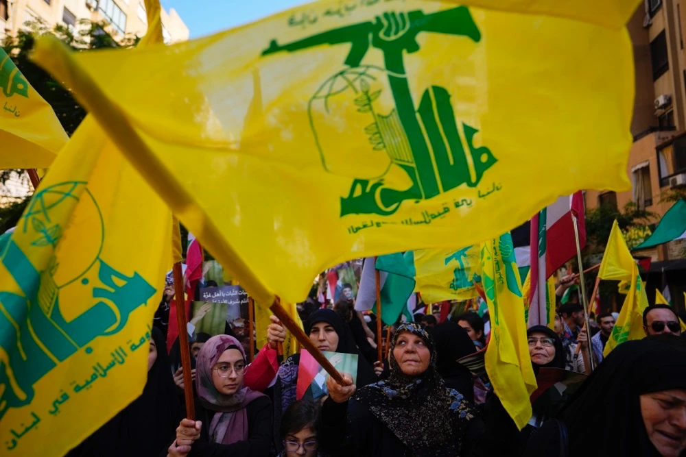 Hezbollah supporters wave Hezbollah flags during a protest in solidarity with the Palestinian people in Gaza, in the southern suburb of Beirut, Lebanon, Wednesday, Oct. 18, 2023. (AP)