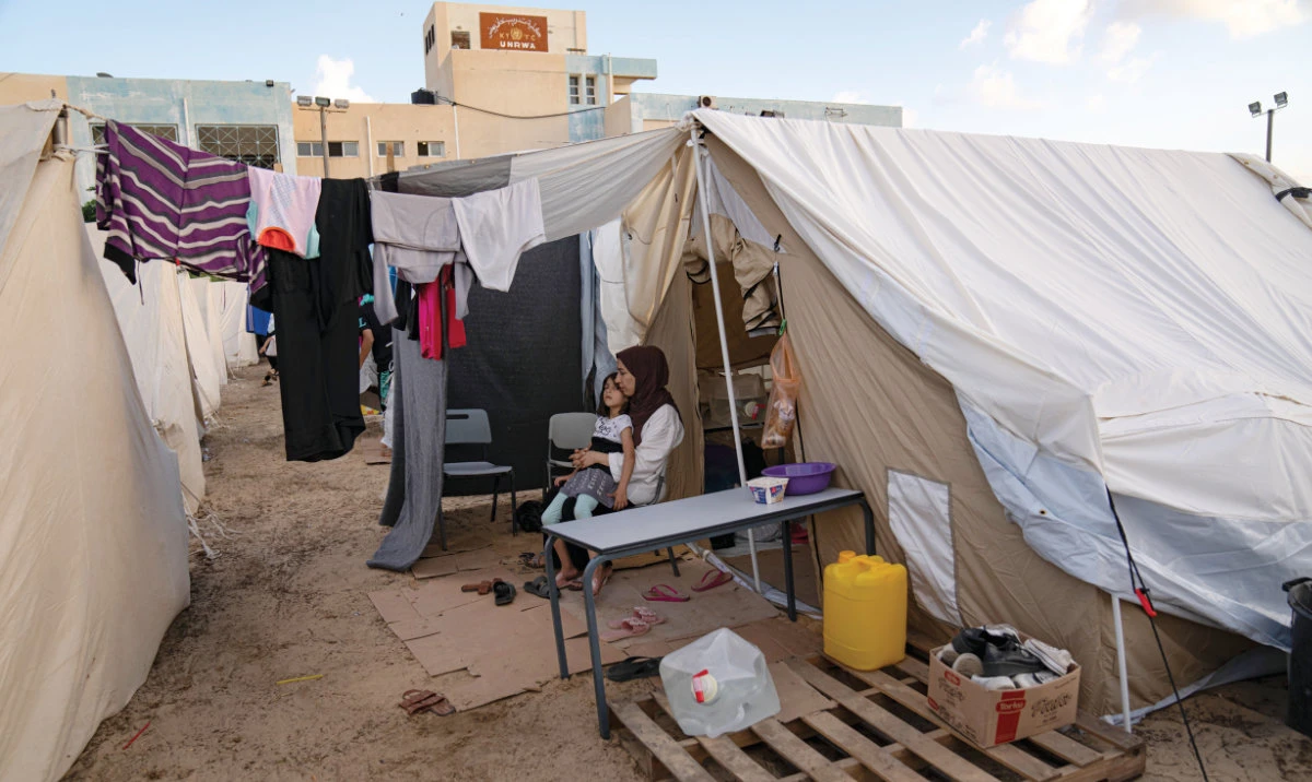 The construction of the tent city in Khan Younis to shelter scores of Palestinians who lost or fled their homes during the past days of intense Israeli bombardment has elicited anger, disbelief and sorrow across the Arab world. (AP)