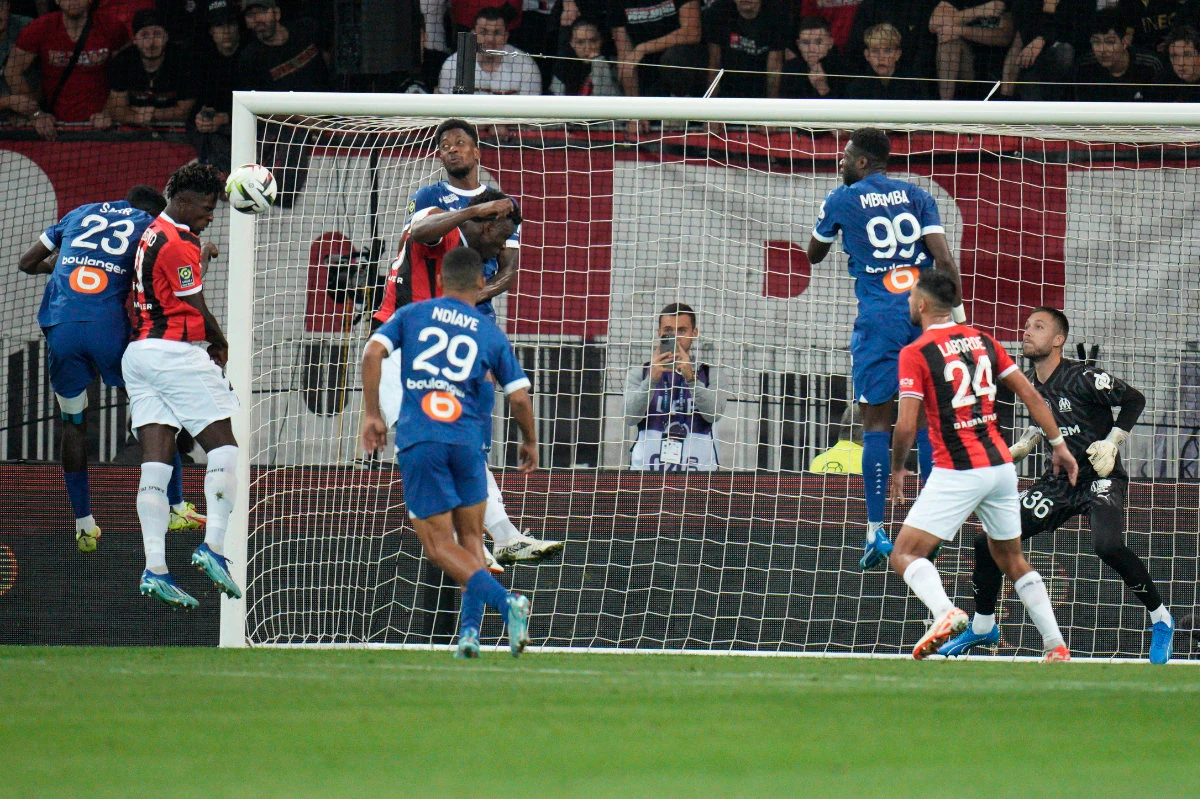 Nice's Evann Guessand, second from left, scores during the French League One soccer match between Nice and Marseille at the Allianz Riviera stadium in Nice on Saturday. (AP)