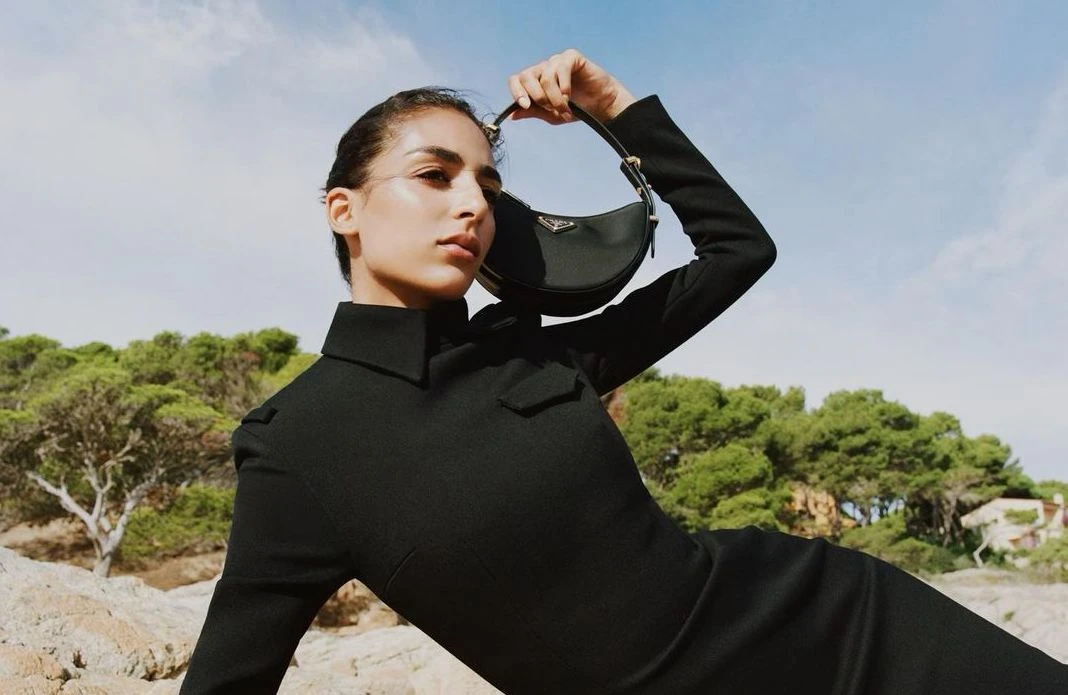 The catwalk star wore a black figure-hugging dress with a collared neckline. (Instagram)