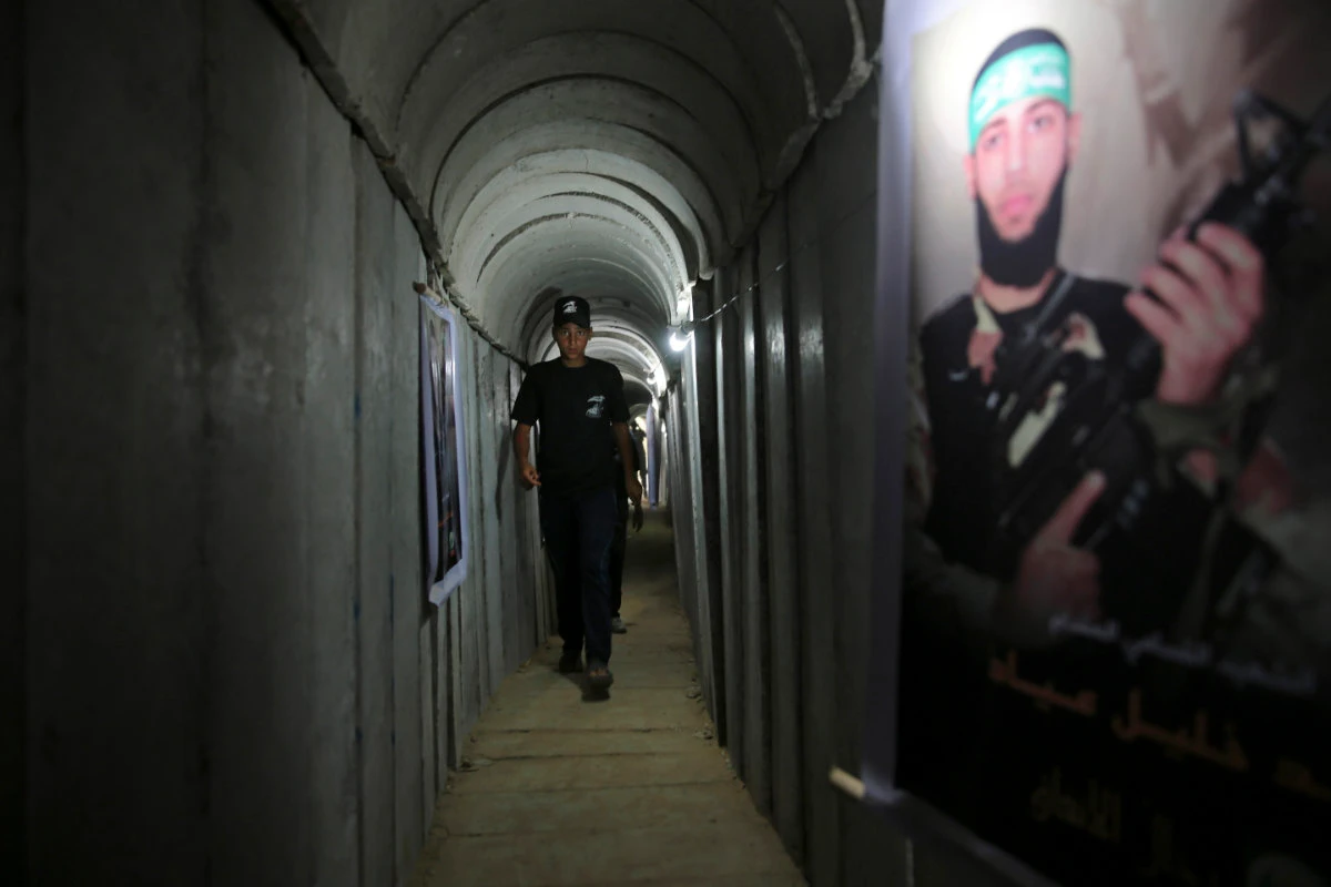 A Palestinian youth walks inside a tunnel used for military exercises during a weapon exhibition at a Hamas-run youth summer camp in Gaza City July 20, 2016. (AP/File)