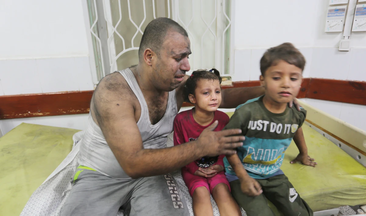 Palestinians wounded in an Israeli strike on the Gaza Strip wait for treatment in a hospital in Rafah on Monday. Concern has surged about the fate of hospitals in the war zone. (AP)