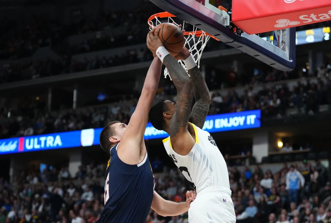 Denver Nuggets center Nikola Jokic blocks the shot of Utah Jazz forward John Collins in the second quarter of their NBA game at Ball Arena. (Supplied)