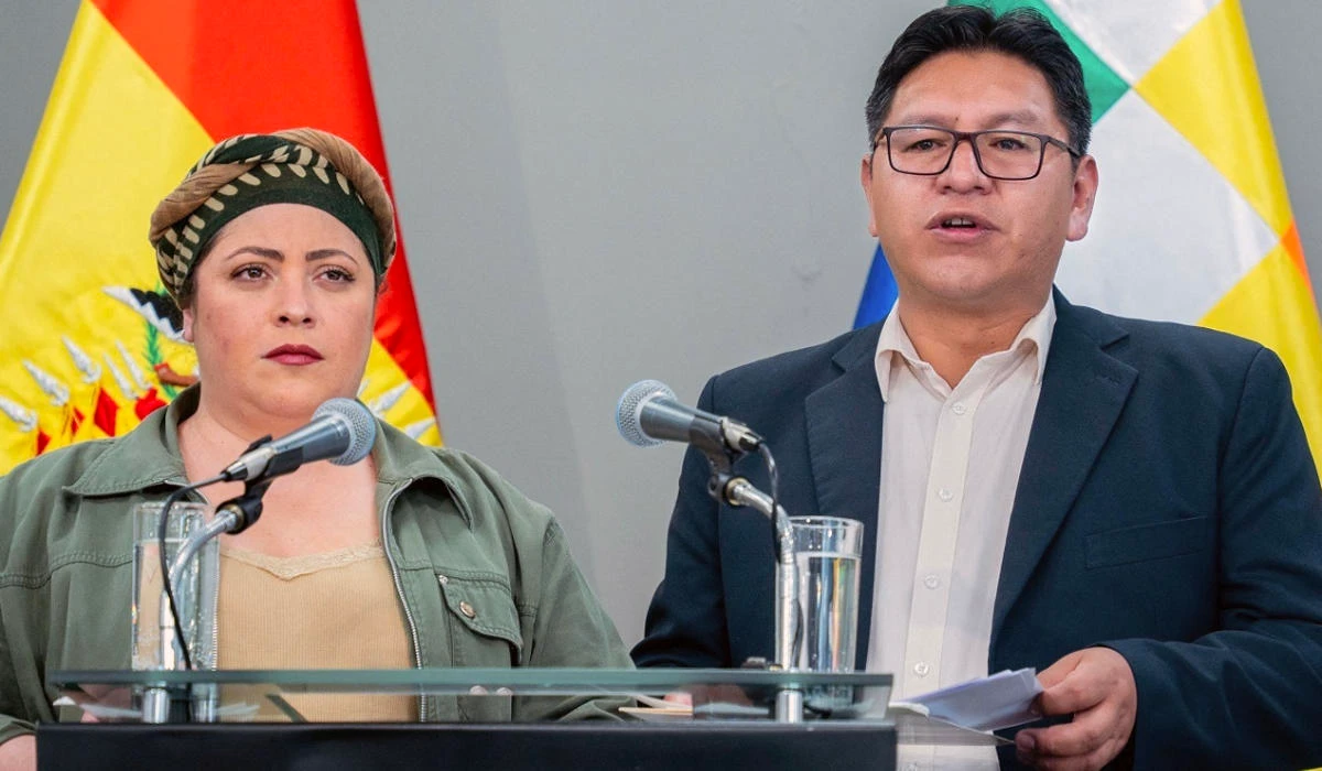 Bolivia's deputy Foreign Minister Freddy Mamani (R) speaks next to the minister of the presidency Maria Nela Prada, during a press conference announcing that Bolivia will break relations with Israel, on October 31, 2023, at the Casa Grande del Pueblo government palace in La Paz, Bolivia. (AFP)