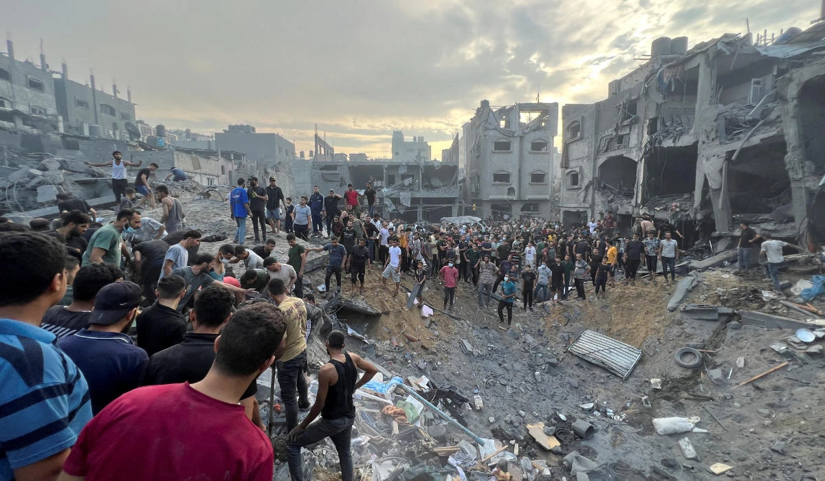 Palestinians search for casualties at the site of Israeli strikes on houses in Gaza Strip, October 31, 2023. (REUTERS)