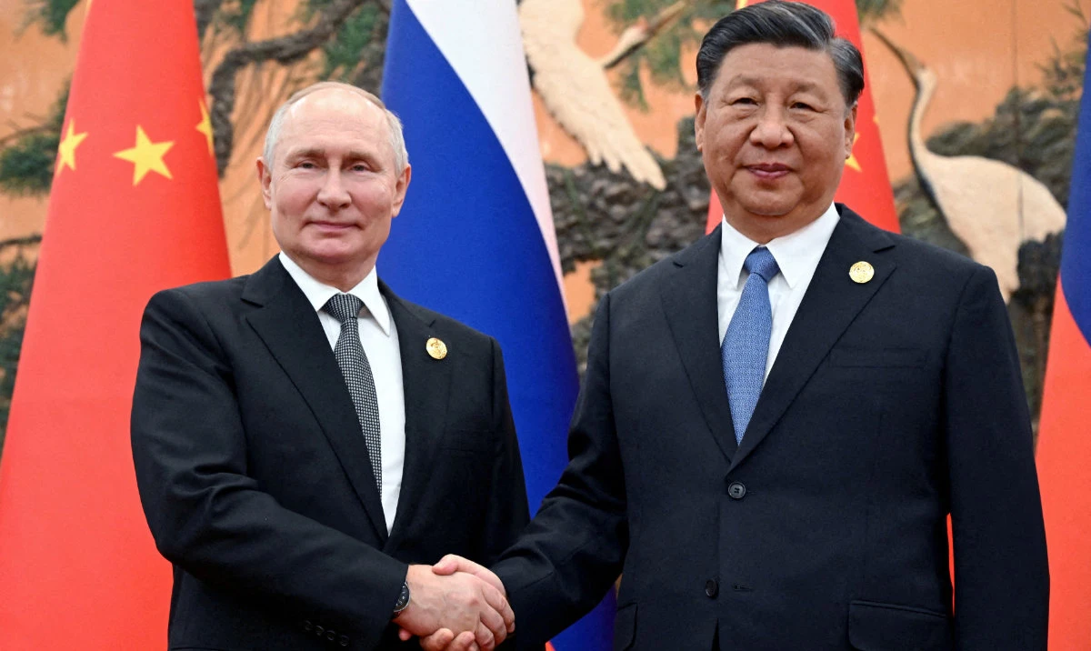 Vladimir Putin shakes hands with Xi Jinping during a meeting at the Belt and Road Forum in Beijing, Oct. 18, 2023. (Reuters)