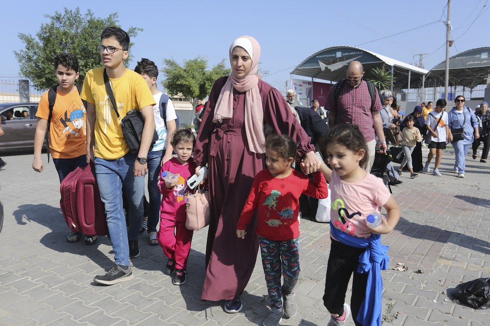 Palestinians cross to the Egyptian side of the border with the Gaza Strip at Rafah crossing on Nov. 1, 2023. (AP)